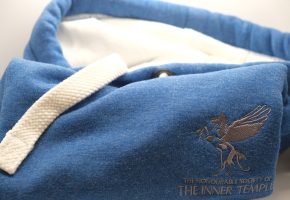 Blue and white hoodie with grey embroidered Pegasus and wordmark